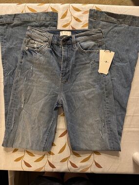 7 For All Mankind Light Wash Flare Jeans with Subtle Distress